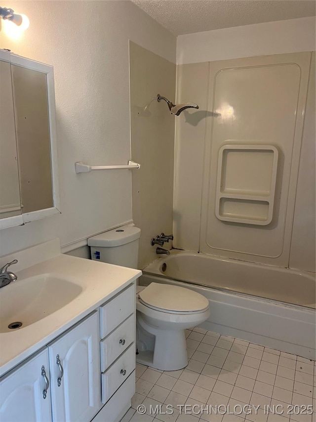 bathroom featuring toilet, tile patterned flooring, a textured ceiling, vanity, and shower / bathing tub combination