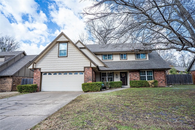 view of front of home featuring driveway, brick siding, a front yard, and fence