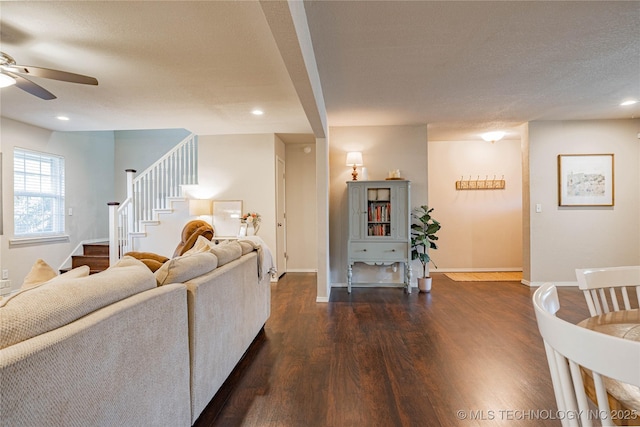 living room with baseboards, stairway, dark wood-type flooring, and recessed lighting