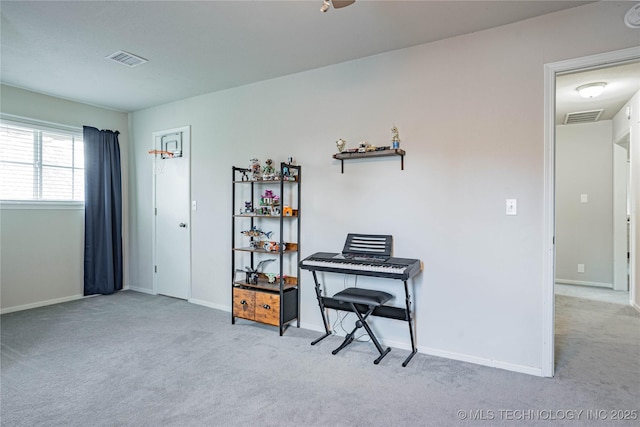 interior space with carpet floors, visible vents, and baseboards