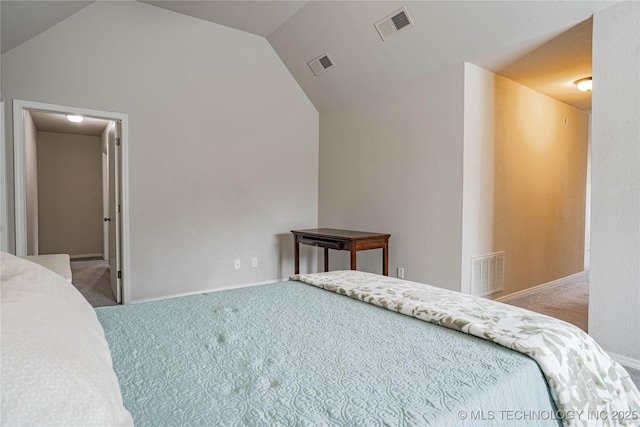 bedroom featuring visible vents, vaulted ceiling, and carpet flooring