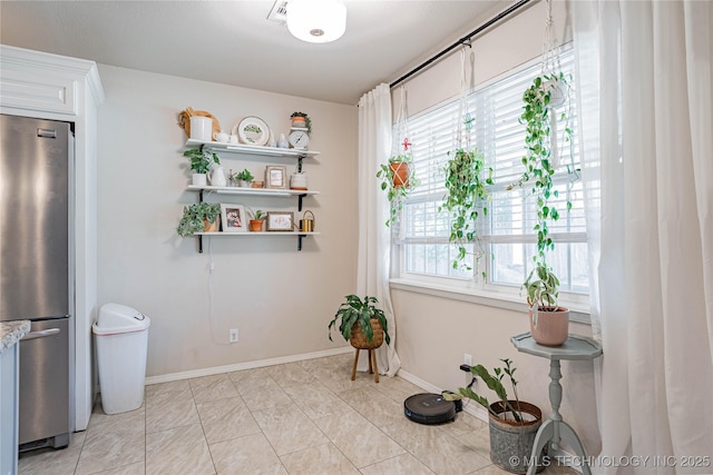 interior space with a healthy amount of sunlight and baseboards