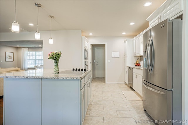 kitchen with recessed lighting, stainless steel appliances, white cabinets, light stone countertops, and decorative light fixtures