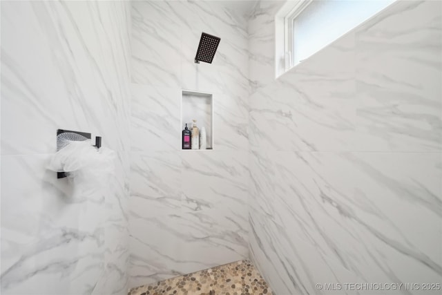 room details with a marble finish shower