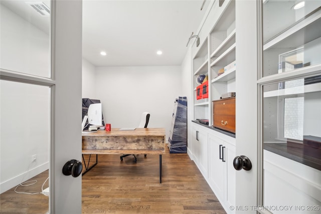 office area featuring recessed lighting, visible vents, baseboards, and wood finished floors