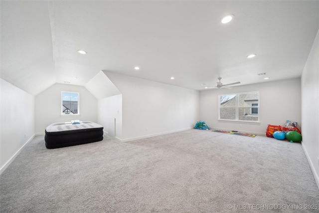 interior space featuring visible vents, baseboards, lofted ceiling, carpet floors, and recessed lighting