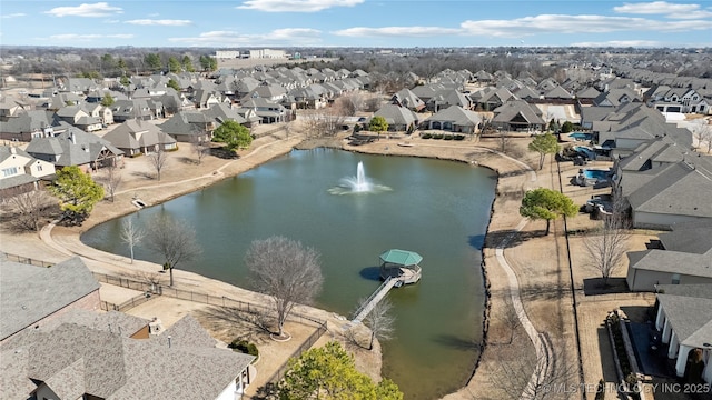 bird's eye view with a water view and a residential view