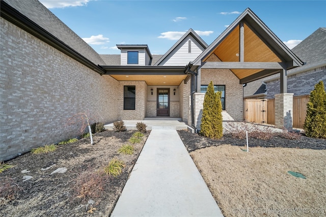 property entrance with brick siding