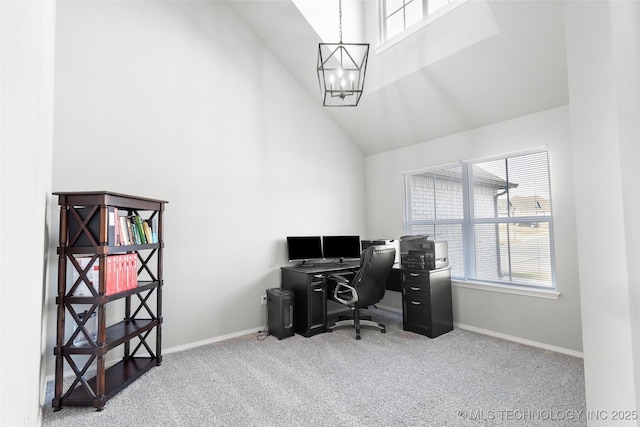 carpeted office space with high vaulted ceiling, baseboards, and an inviting chandelier