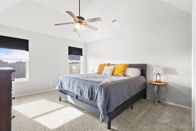 bedroom featuring carpet floors, visible vents, baseboards, and multiple windows