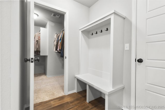 mudroom with dark wood finished floors and visible vents