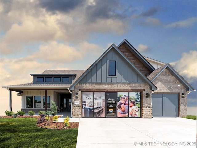 view of front of property with board and batten siding, concrete driveway, and an attached garage