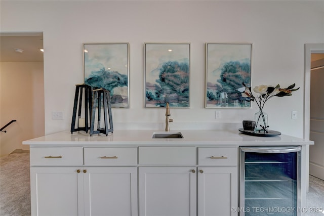 bar featuring beverage cooler and a sink