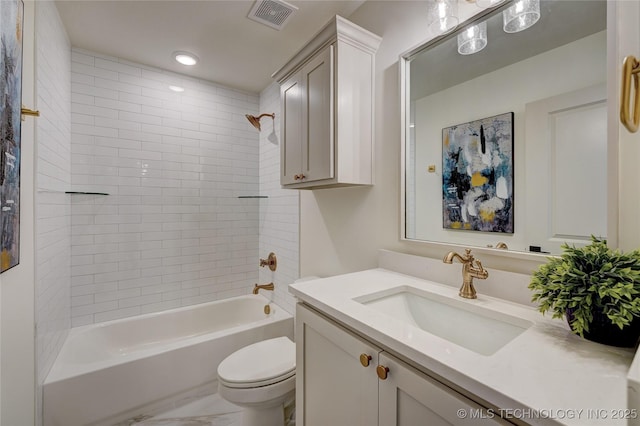 bathroom featuring visible vents, toilet, shower / tub combination, marble finish floor, and vanity