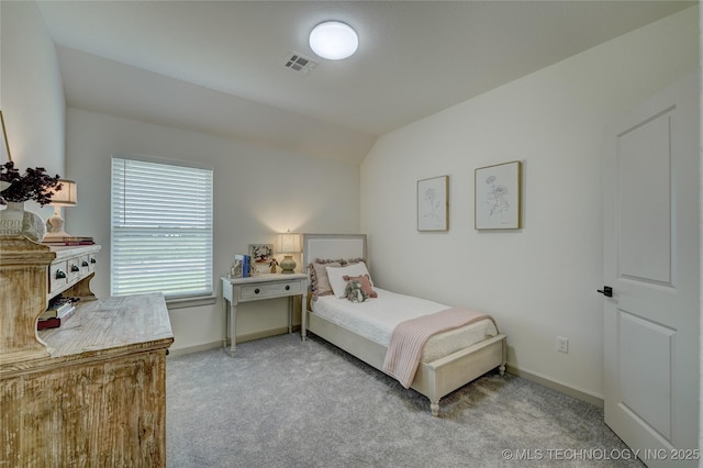 bedroom with lofted ceiling, visible vents, light carpet, and baseboards