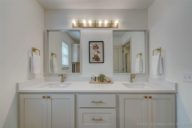 bathroom featuring double vanity and a sink