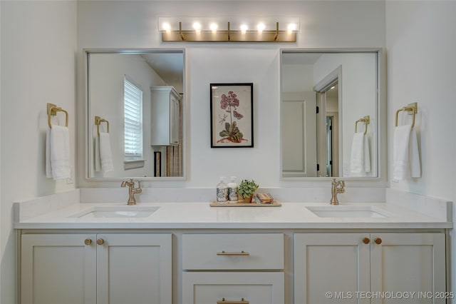 bathroom featuring double vanity and a sink