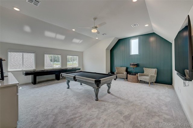 rec room featuring light carpet, visible vents, and lofted ceiling