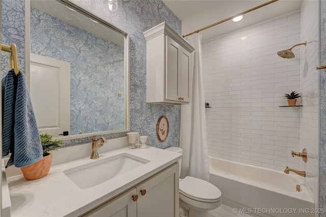 bathroom featuring shower / bathtub combination with curtain, vanity, toilet, and wallpapered walls