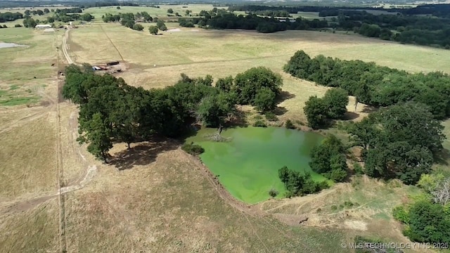 birds eye view of property with a rural view and a water view