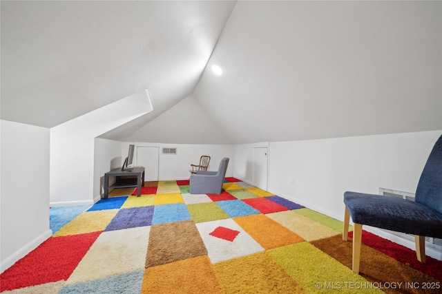 game room with carpet floors, visible vents, vaulted ceiling, and baseboards