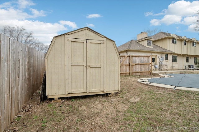 view of shed featuring a fenced backyard