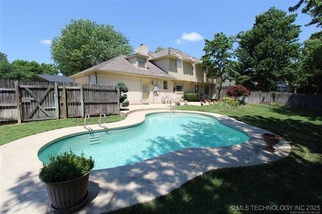 view of pool with a fenced in pool, a fenced backyard, a yard, and a patio