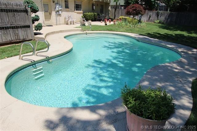 view of pool with a fenced in pool, a patio area, and fence