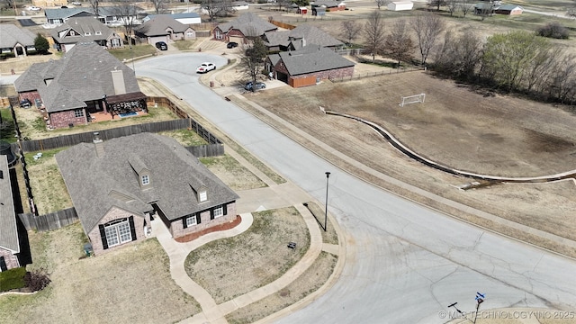 birds eye view of property with a residential view