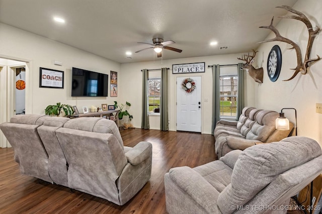 living area featuring a ceiling fan, visible vents, dark wood-style flooring, and recessed lighting