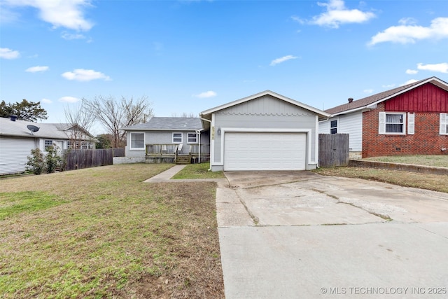 ranch-style house featuring a front yard, fence, an attached garage, concrete driveway, and board and batten siding