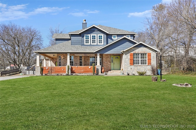 view of front of property featuring a porch, a chimney, a front lawn, and fence