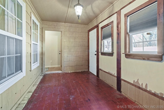 hall with hardwood / wood-style flooring