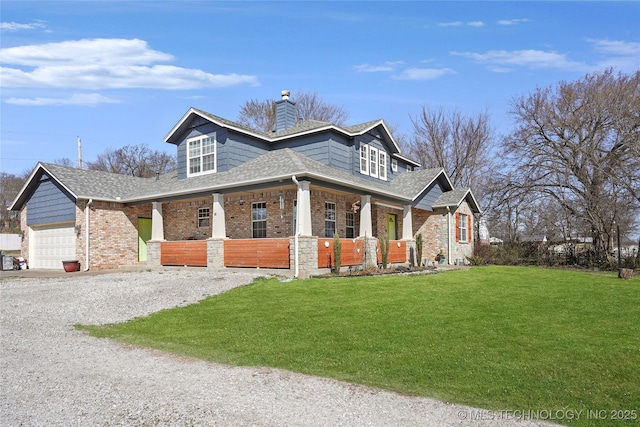 view of front of property featuring driveway, an attached garage, covered porch, a chimney, and a front lawn