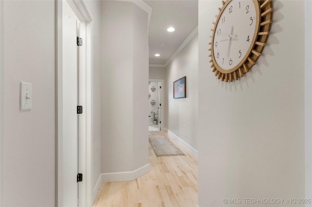 hall featuring crown molding, recessed lighting, light wood-type flooring, and baseboards