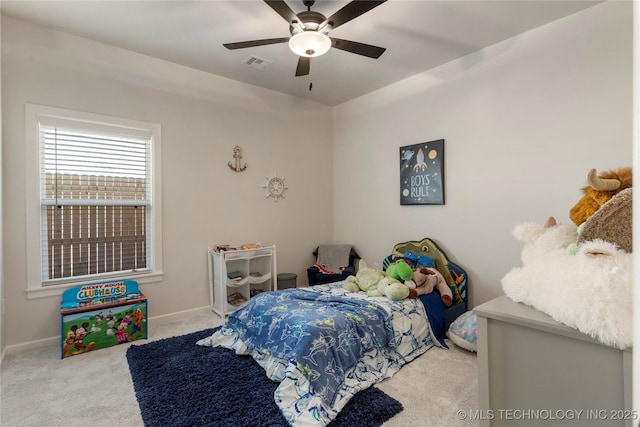 carpeted bedroom with ceiling fan, visible vents, and baseboards