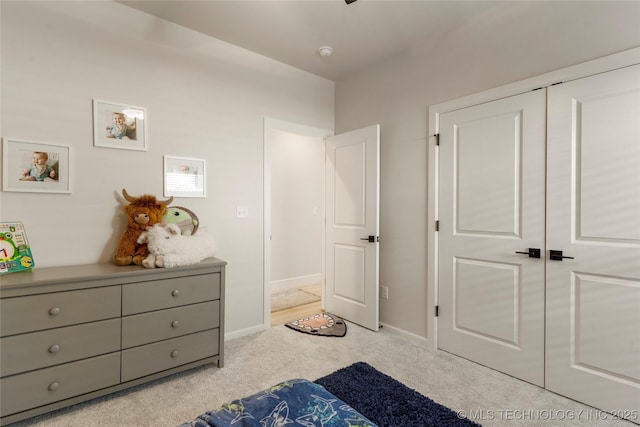 carpeted bedroom with baseboards