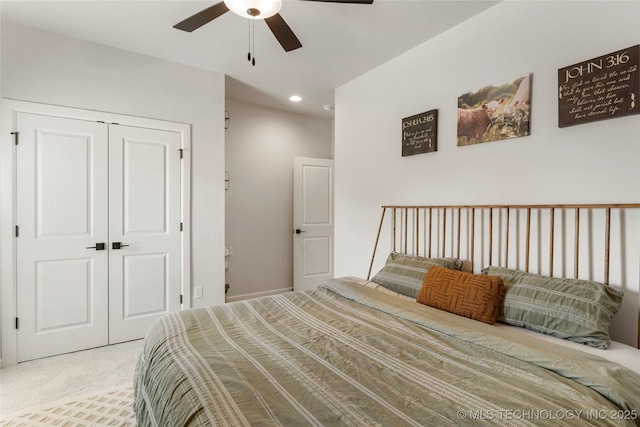 carpeted bedroom featuring a ceiling fan, a closet, and recessed lighting