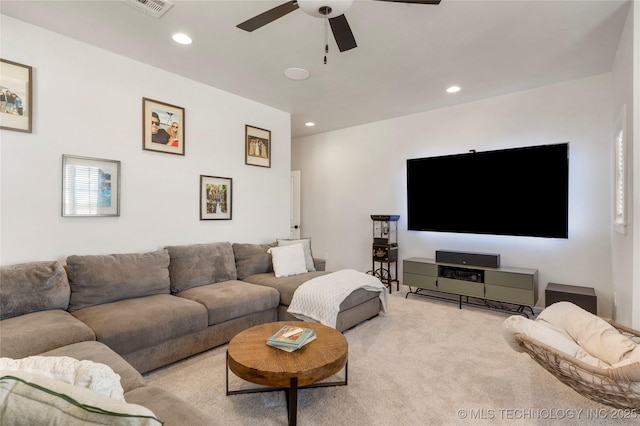 carpeted living area featuring a ceiling fan, recessed lighting, and visible vents