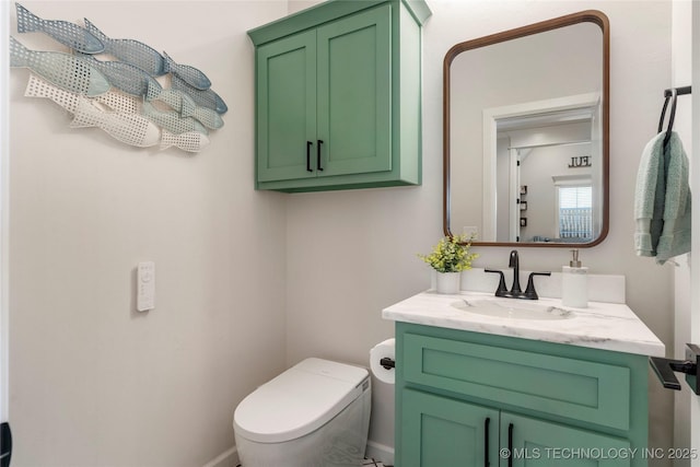 half bathroom featuring toilet and vanity