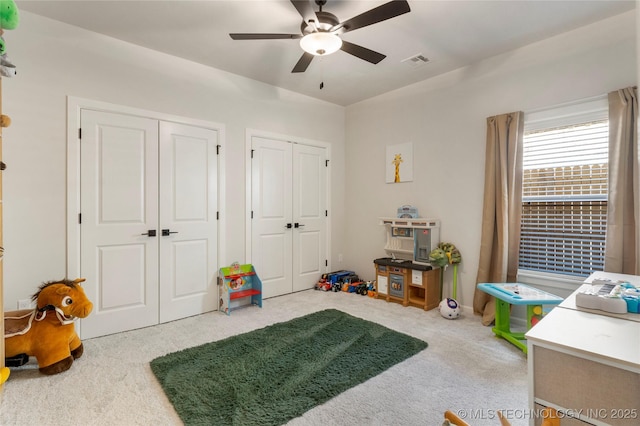 recreation room featuring carpet and visible vents