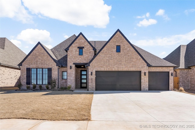 view of front of property featuring driveway, roof with shingles, and brick siding