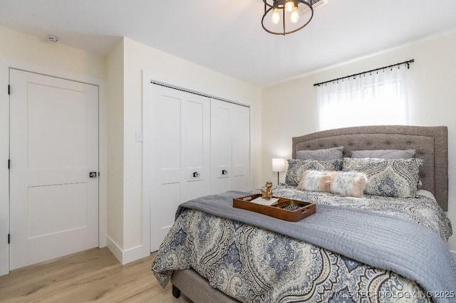 bedroom featuring a closet and wood finished floors