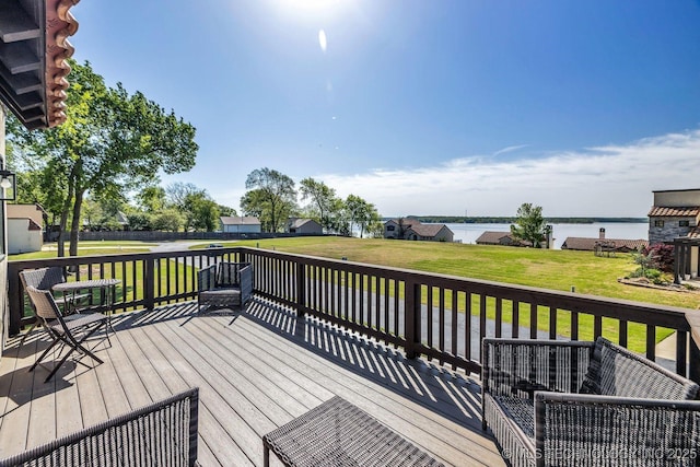 wooden terrace with a yard, a water view, and a residential view