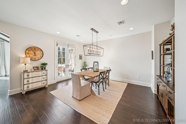 dining room featuring baseboards, visible vents, dark wood finished floors, and recessed lighting