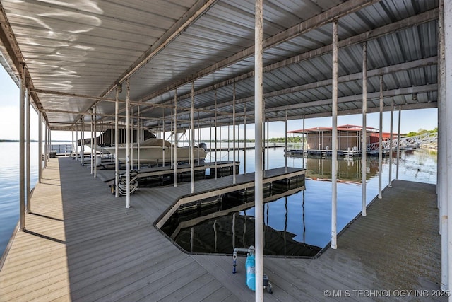 view of dock featuring a water view and boat lift