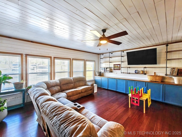 living room featuring dark wood-type flooring and a ceiling fan