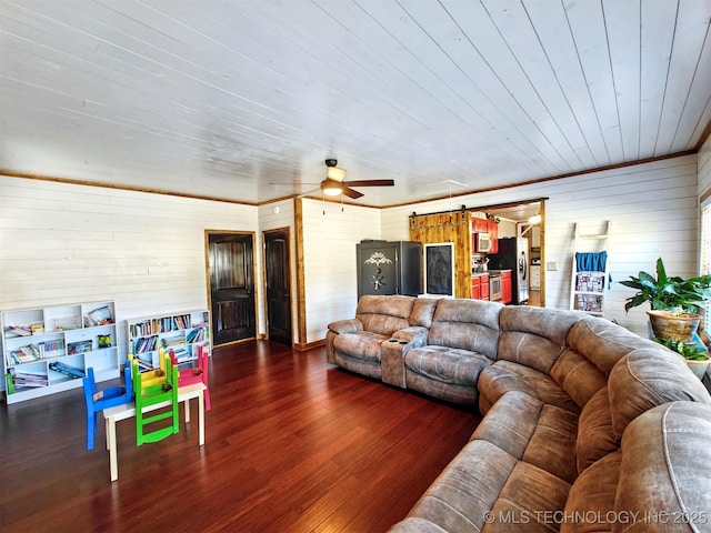 living room with ceiling fan and wood finished floors