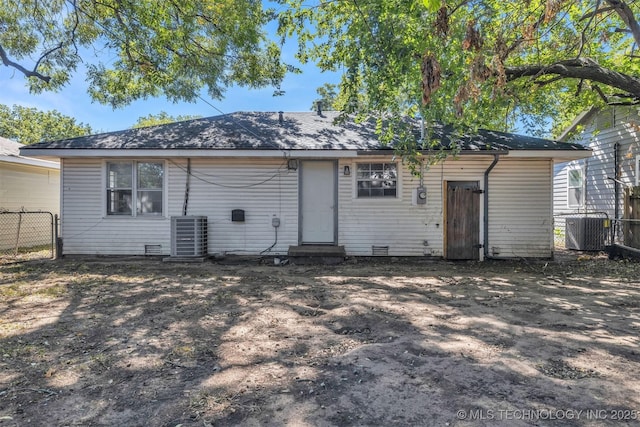 back of house featuring crawl space, cooling unit, and fence