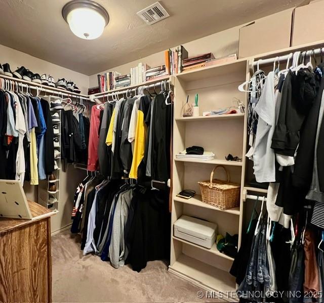 walk in closet featuring visible vents